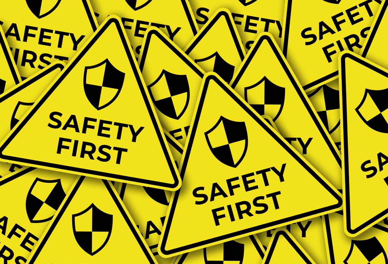 group of safety first warning signs